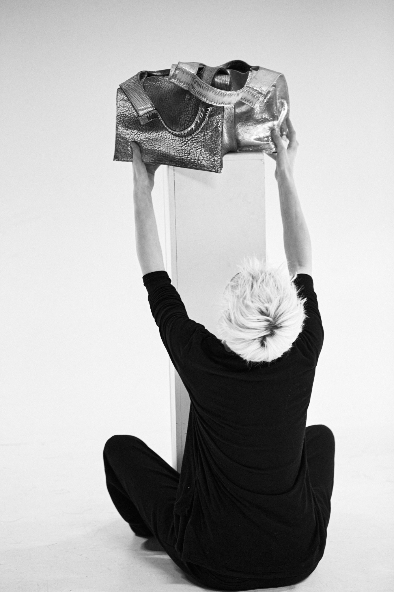 ann The designer is preparing the bags for the shoot